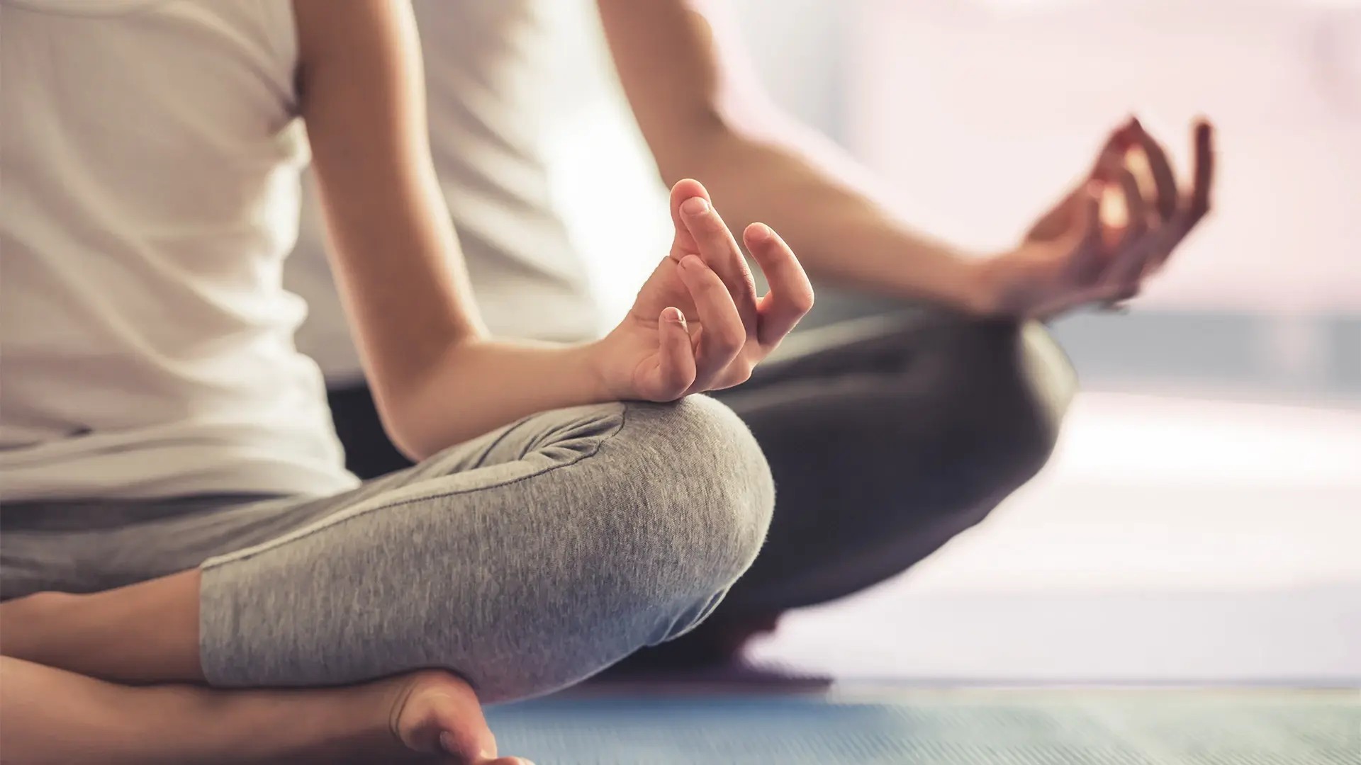 Person in a calm seated position — how to regulate your nervous system in 5 minutes